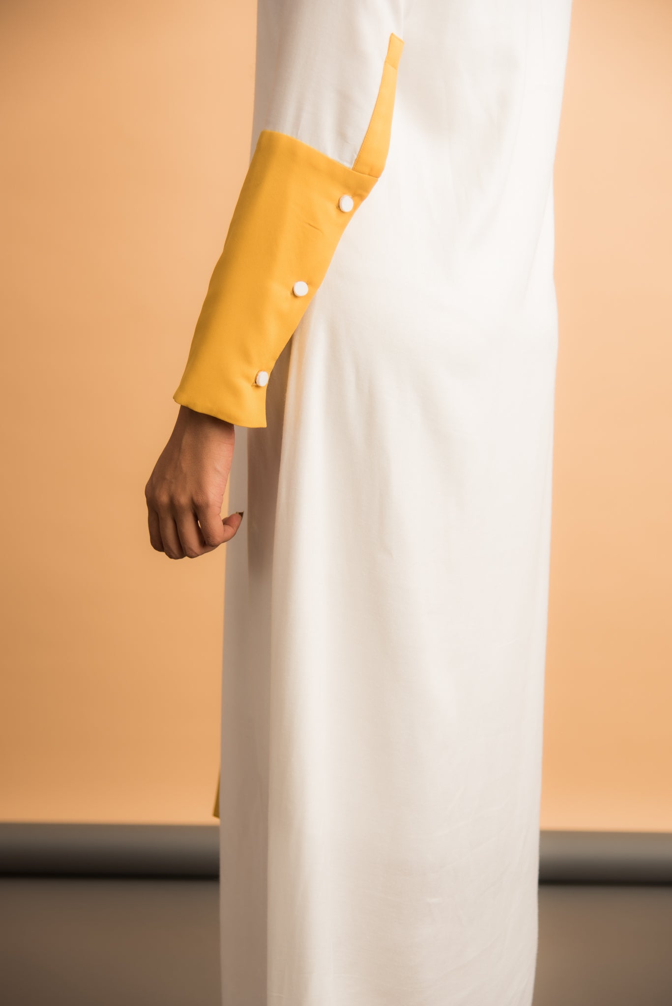 White asymmetrical dress with yellow details